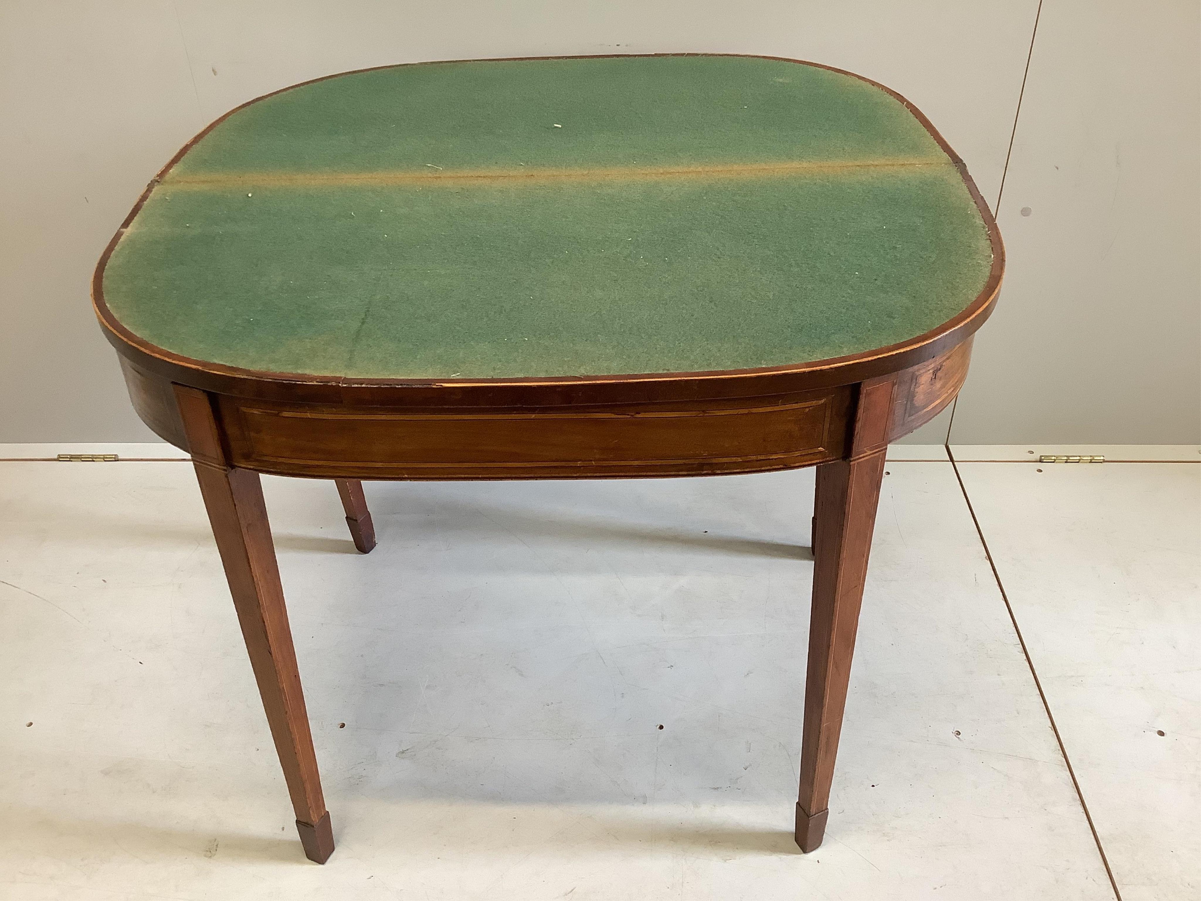 A George III banded mahogany D shape folding card table, width 91cm, depth 43cm, height 74cm. Condition - fair